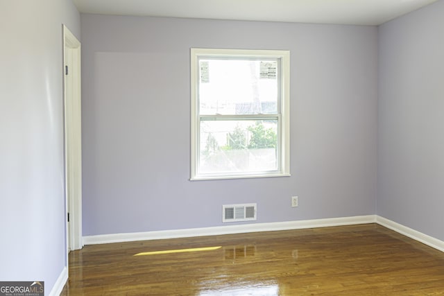 2666 Frontier Trl, Atlanta, GA 30341 - unfurnished room featuring baseboards, wood finished floors, and visible vents