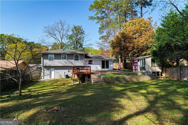 2666 Frontier Trl, Atlanta, GA 30341 - rear view of property with an outdoor structure, a lawn, a fenced backyard, and a deck