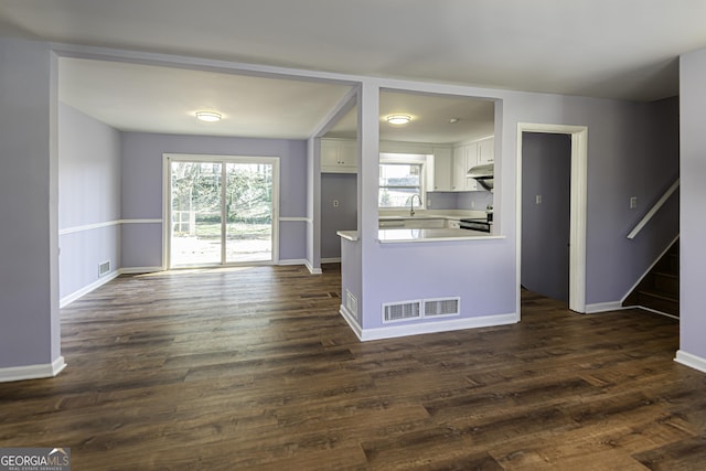 2666 Frontier Trl, Atlanta, GA 30341 - kitchen with visible vents, under cabinet range hood, white cabinets, and stainless steel range with electric cooktop