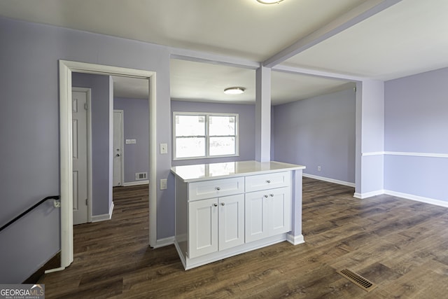 2666 Frontier Trl, Atlanta, GA 30341 - kitchen with white cabinets, baseboards, dark wood-type flooring, and visible vents