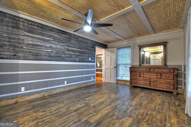 unfurnished bedroom featuring a ceiling fan, wooden ceiling, and dark wood-type flooring