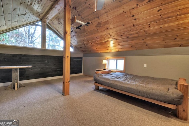 bedroom featuring carpet flooring, wood ceiling, and vaulted ceiling