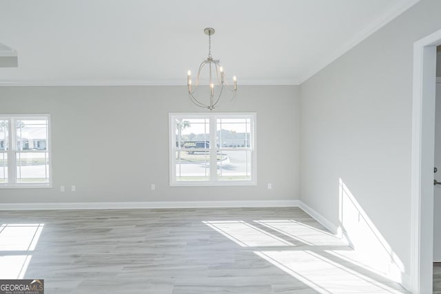 114 Richard Lee Dr, Kingsland, GA 31548 - unfurnished room with a chandelier, crown molding, healthy amount of natural light, and light wood finished floors