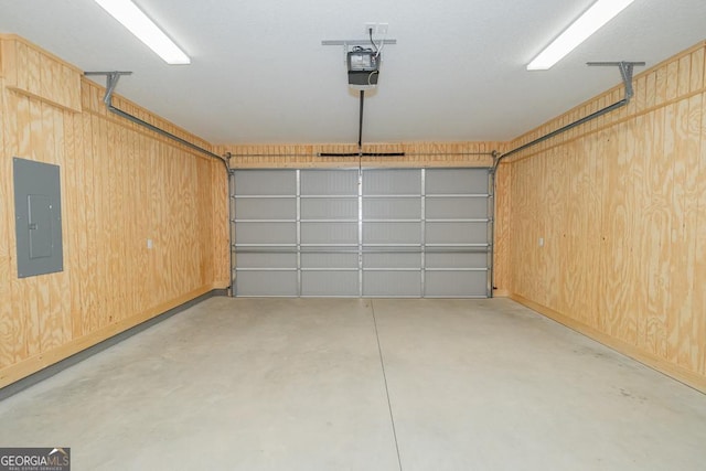 114 Richard Lee Dr, Kingsland, GA 31548 - garage with electric panel and a garage door opener