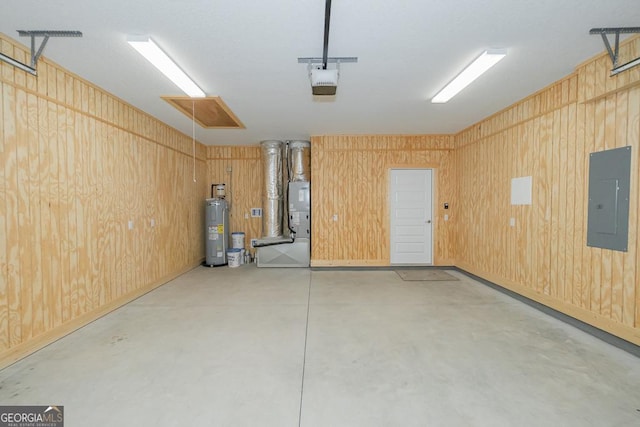 114 Richard Lee Dr, Kingsland, GA 31548 - garage with electric panel, electric water heater, a garage door opener, heating unit, and wooden walls