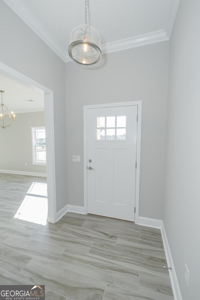 114 Richard Lee Dr, Kingsland, GA 31548 - foyer with a chandelier and crown molding