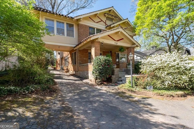 2265 E Lake Rd NE, Atlanta, GA 30307 - view of front of property featuring brick siding and aphalt driveway