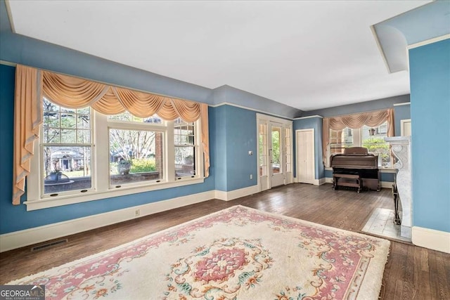 2265 E Lake Rd NE, Atlanta, GA 30307 - living area with baseboards, visible vents, and wood finished floors