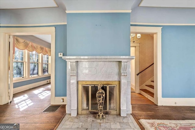 2265 E Lake Rd NE, Atlanta, GA 30307 - room details with ornamental molding, baseboards, a premium fireplace, and wood finished floors