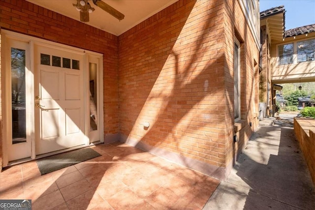 2265 E Lake Rd NE, Atlanta, GA 30307 - doorway to property featuring brick siding and ceiling fan