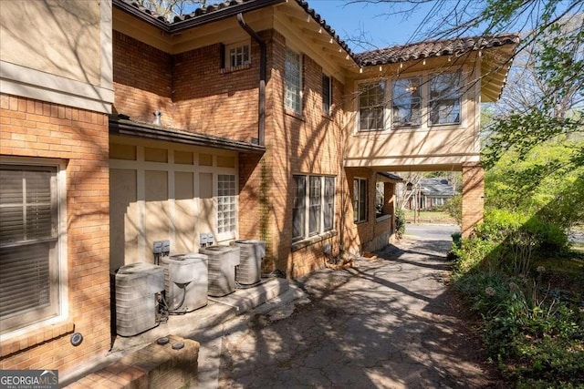 2265 E Lake Rd NE, Atlanta, GA 30307 - back of house featuring brick siding and central AC unit