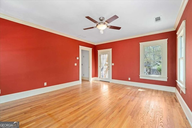 2265 E Lake Rd NE, Atlanta, GA 30307 - unfurnished room featuring ornamental molding, baseboards, light wood-style floors, visible vents, and a ceiling fan