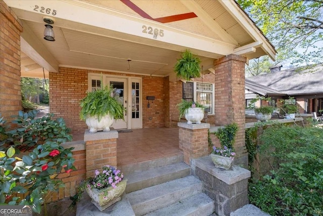 2265 E Lake Rd NE, Atlanta, GA 30307 - view of exterior entry with covered porch and brick siding
