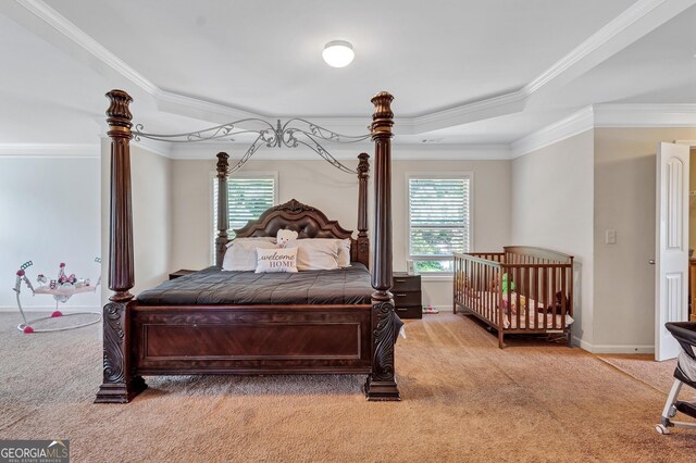 bedroom with light colored carpet, ornamental molding, and multiple windows
