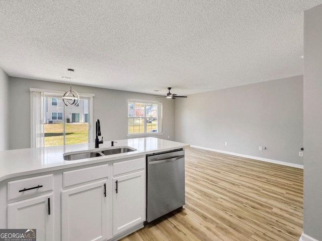7229 Georges Way, Morrow, GA 30260 - kitchen with white cabinets, a sink, light wood-style floors, dishwasher, and a ceiling fan