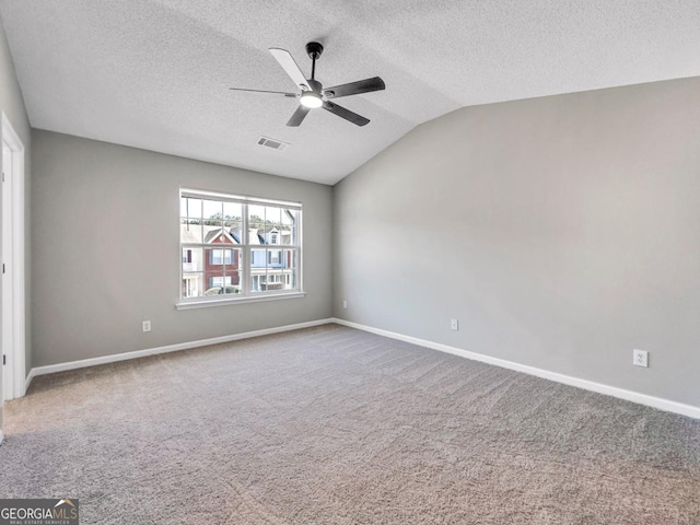 7229 Georges Way, Morrow, GA 30260 - carpeted spare room with baseboards, visible vents, ceiling fan, and vaulted ceiling