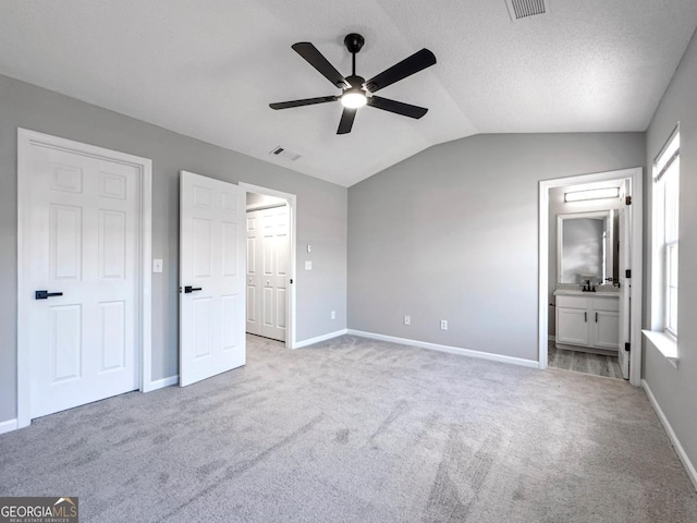 7229 Georges Way, Morrow, GA 30260 - unfurnished bedroom with light carpet, lofted ceiling, and visible vents
