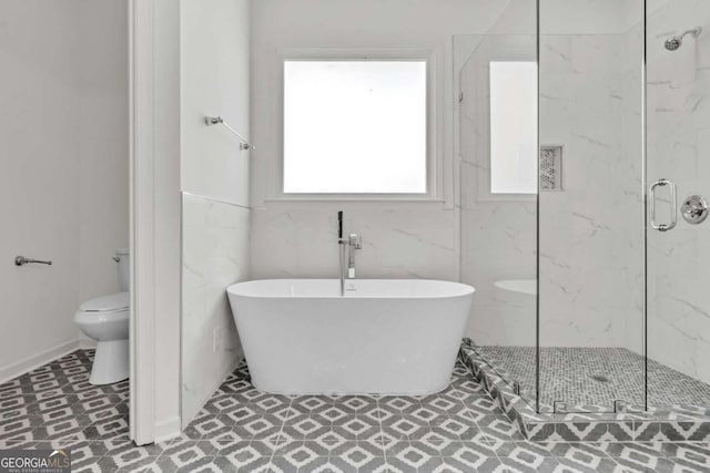 7503 Brookstone Cir, Flowery Branch, GA 30542 - bathroom featuring a marble finish shower, toilet, and a freestanding bath