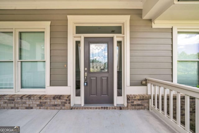 7503 Brookstone Cir, Flowery Branch, GA 30542 - entrance to property featuring a porch