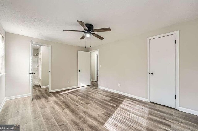 bedroom with baseboards, ceiling fan, and light wood finished floors
