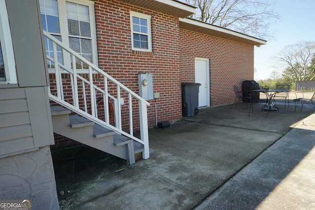 1848 Tenny Nelson Rd, Grantville, GA 30220 - back of house with brick siding, entry steps, and a patio area