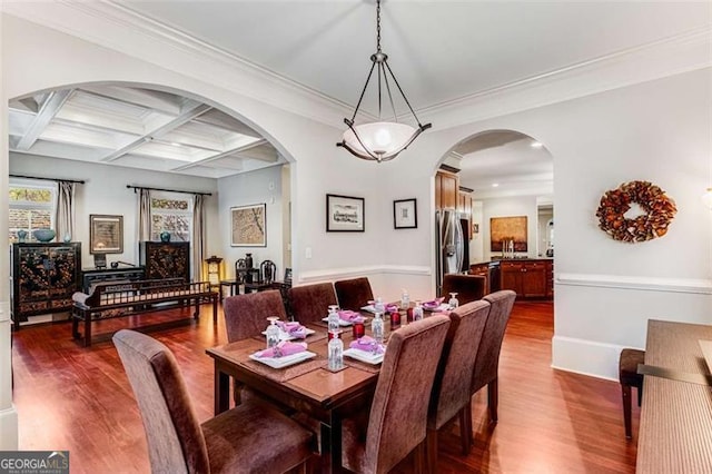 1109 Pine Grove Ave, Brookhaven, GA 30319 - dining area with dark wood finished floors, arched walkways, beam ceiling, and coffered ceiling
