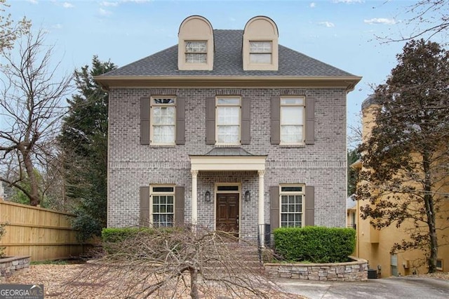 1109 Pine Grove Ave, Brookhaven, GA 30319 - colonial-style house featuring brick siding and roof with shingles