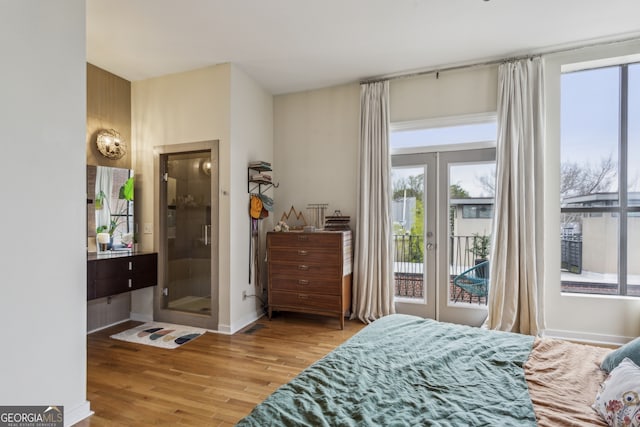307 Cherokee Ave SE Unit 3, Atlanta, GA 30312 - bedroom with access to outside, wood finished floors, multiple windows, and french doors