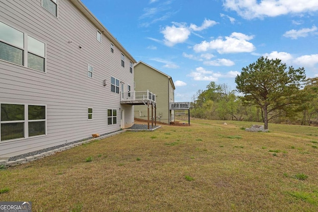 view of yard with a wooden deck