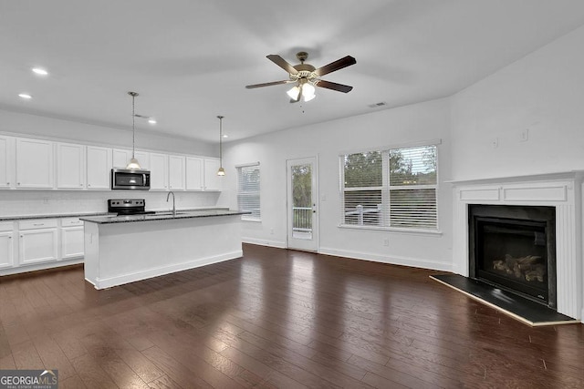 kitchen featuring dark wood finished floors, open floor plan, visible vents, and appliances with stainless steel finishes