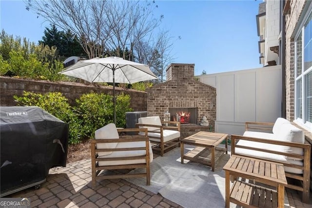 557 Stone Field Run NW, Marietta, GA 30060 - view of patio / terrace featuring a grill, an outdoor living space with a fireplace, and fence
