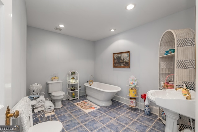 2977 Glover Dr, Cumming, GA 30040 - full bath featuring a freestanding tub, tile patterned flooring, and recessed lighting
