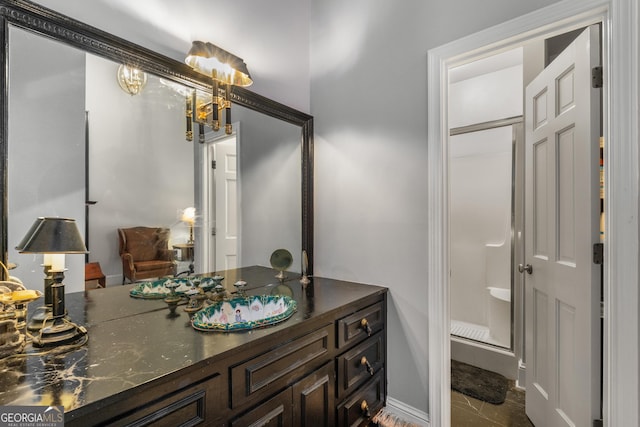 2977 Glover Dr, Cumming, GA 30040 - full bathroom featuring vanity, a shower stall, a chandelier, and tile patterned floors