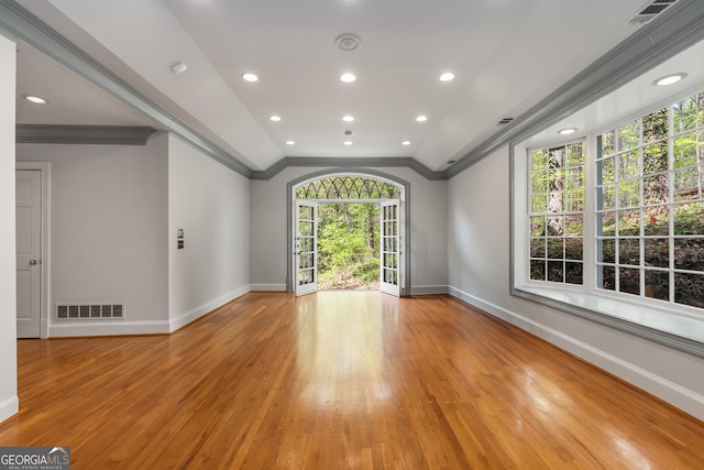 2977 Glover Dr, Cumming, GA 30040 - spare room featuring crown molding, light wood finished floors, lofted ceiling, and recessed lighting