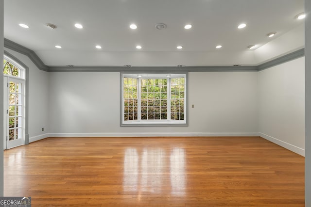 2977 Glover Dr, Cumming, GA 30040 - spare room featuring crown molding, healthy amount of natural light, light wood-style flooring, and recessed lighting