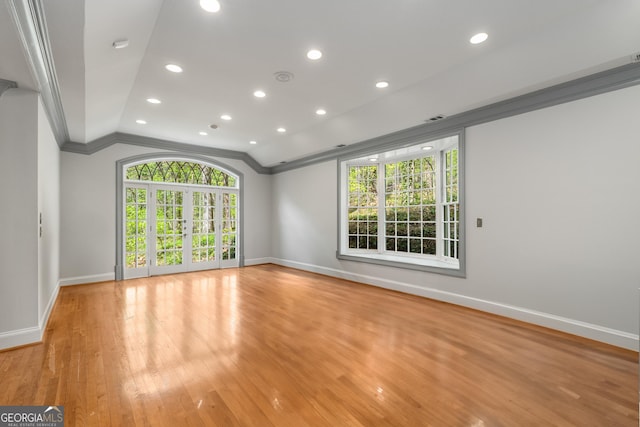 2977 Glover Dr, Cumming, GA 30040 - empty room featuring ornamental molding, light wood finished floors, vaulted ceiling, and recessed lighting