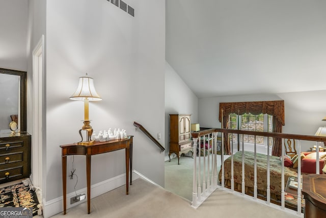 2977 Glover Dr, Cumming, GA 30040 - stairway featuring high vaulted ceiling and carpet floors