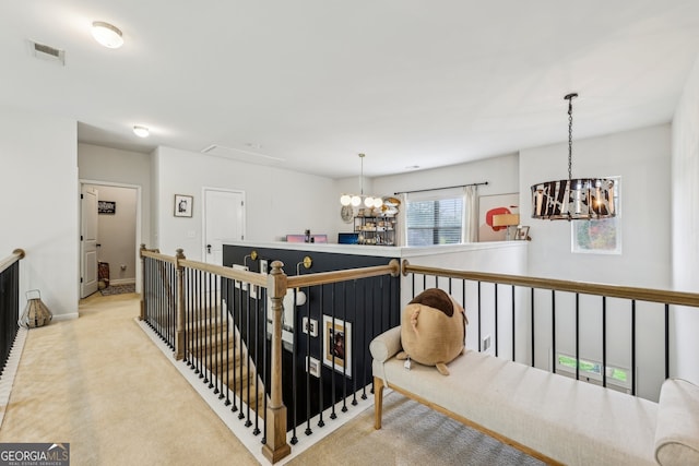 5225 Tye Trl, Fairburn, GA 30213 - hall featuring a chandelier, an upstairs landing, carpet floors, and baseboards