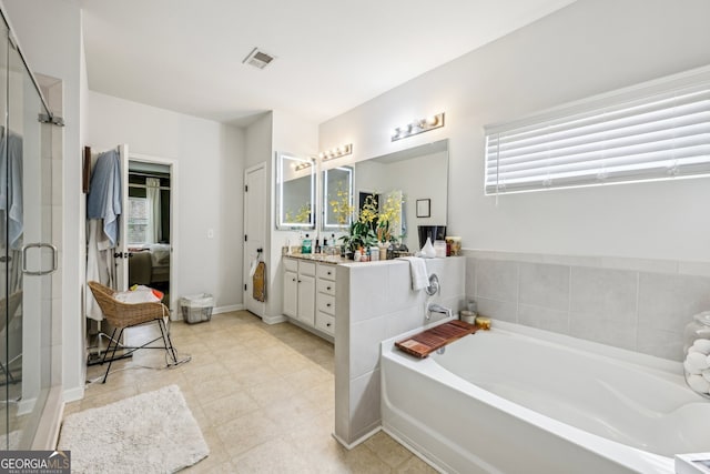 5225 Tye Trl, Fairburn, GA 30213 - bathroom featuring vanity, a bath, a stall shower, and ensuite bathroom