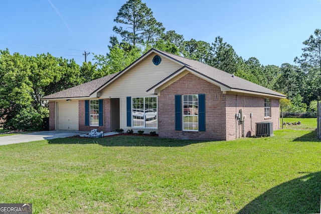 ranch-style house with brick siding, driveway, central AC, and a front yard