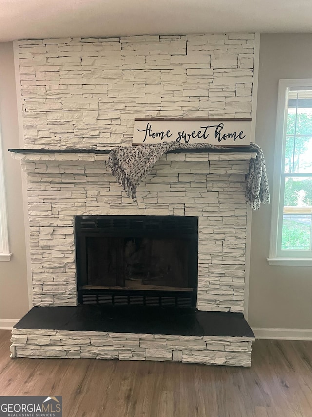 140 Elberta Dr, Newnan, GA 30265 - detailed view of a fireplace, baseboards, and wood finished floors
