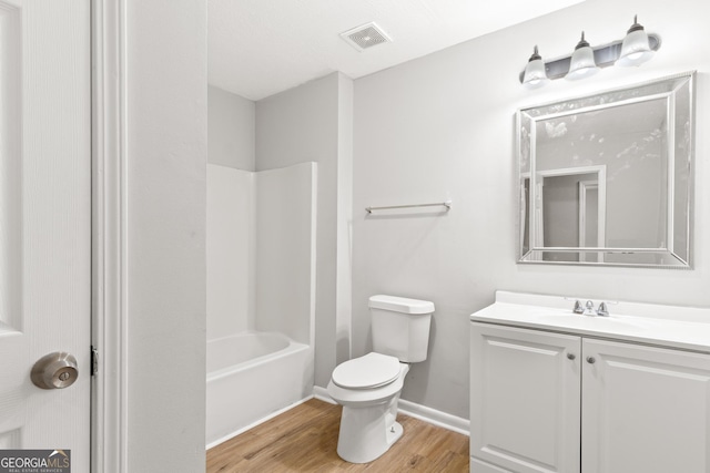 140 Elberta Dr, Newnan, GA 30265 - full bath with wood finished floors, vanity, toilet, bathtub / shower combination, and baseboards