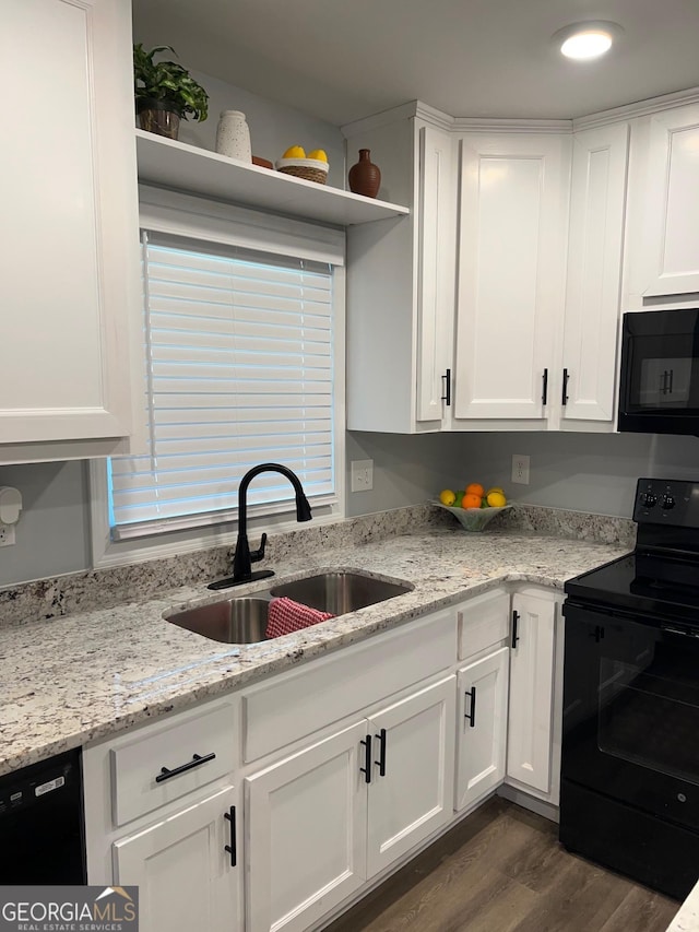 1815 Old Salem Rd SE, Conyers, GA 30013 - kitchen featuring white cabinets, a sink, open shelves, dark wood-style floors, and black appliances