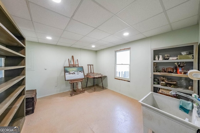 office space featuring a sink, recessed lighting, baseboards, and a drop ceiling