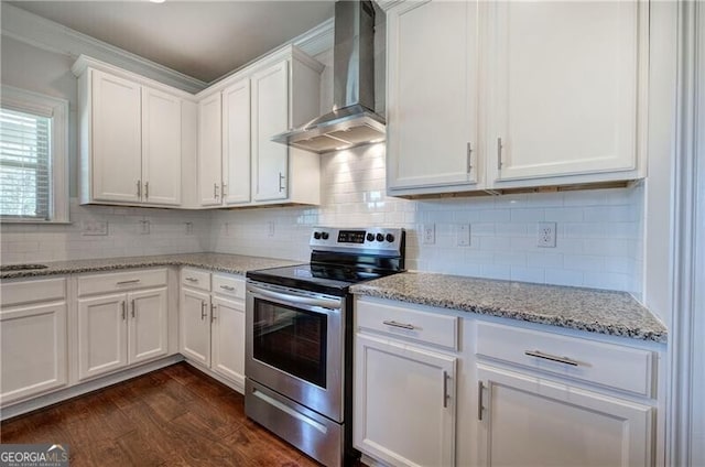 106 Lighthouse Cv SW, Adairsville, GA 30103 - kitchen featuring electric range, wall chimney range hood, white cabinetry, dark wood-style floors, and decorative backsplash