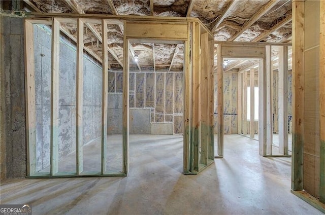 miscellaneous room featuring unfinished concrete floors