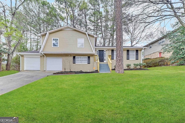 4183 Northstrand Dr, Decatur, GA 30035 - tri-level home with a front yard, an attached garage, brick siding, and concrete driveway