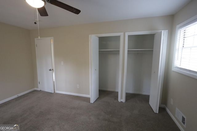 4183 Northstrand Dr, Decatur, GA 30035 - unfurnished bedroom with baseboards, multiple closets, visible vents, and carpet floors