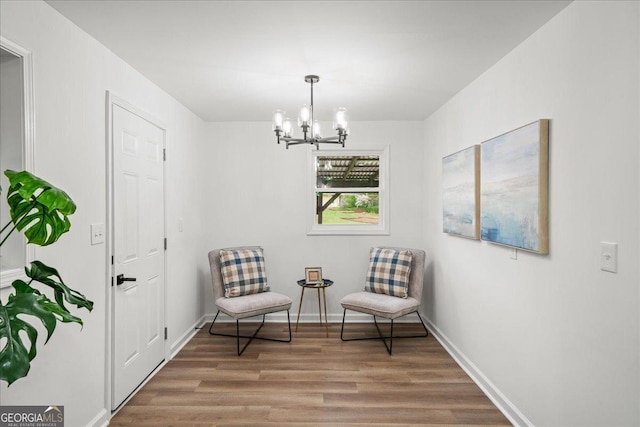 3951 Covered Bridge Rd SW, Smyrna, GA 30082 - sitting room featuring wood finished floors, a chandelier, and baseboards