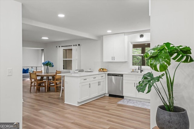 3951 Covered Bridge Rd SW, Smyrna, GA 30082 - kitchen with dishwasher, a peninsula, white cabinetry, a sink, and recessed lighting